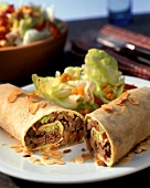Enchiladas with apple and mince filling and lettuce