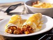 Chicken enchiladas with peppers and cheese
