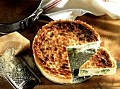 Cauliflower tart with cheese (a piece cut)