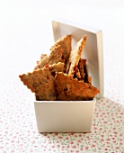 Savoury wholemeal biscuits in white bowl