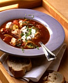 Fish soup with tomatoes and sour cream