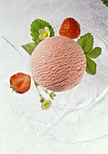 Strawberry ice cream with strawberries and leaves