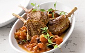 Lamb chops on tomatoes and aubergines
