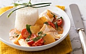 Red fish curry with pineapple and cherry tomatoes