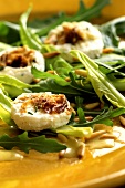 Dandelion leaf salad with rocket and fresh goat's cheese