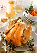 Stuffed roast chicken; carrots; white wine