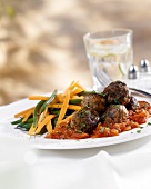 Meatballs with tomato sauce and vegetables