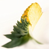 Quarter of a pineapple with leaves