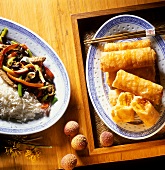 Spring rolls; beef ragout with beans and rice; lychees