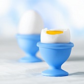 Soft-boiled egg in pale-blue egg cup