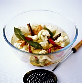 Pickled cauliflower with spices in glass dish