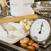 Baking ingredients (flour, butter, eggs) with scales