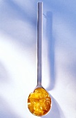 Apricot jam on spoon