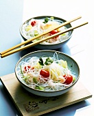 Asian rice noodles with shrimps and cherry tomatoes