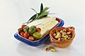 Cheese with olives and pistachios