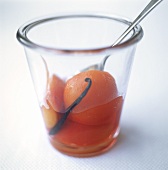 Apricot compote with vanilla pod in glass