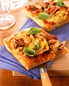 Tuna pizza with artichokes and basil