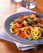 Strips of pork with peppers and home-made noodles