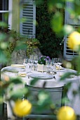 Laid table in front of French country house