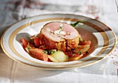 Saddle of lamb with tomato ragout and basil
