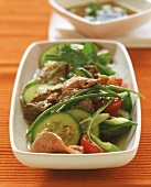 Spicy beef salad with cucumber and tomatoes