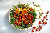 Tomato salad with olives, sheep's cheese & edible flowers