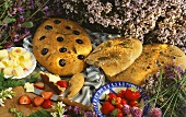 Assorted herb breads, fresh strawberries and butter