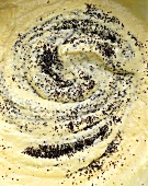 Creamed cake mixture with poppy seeds (filling the picture)