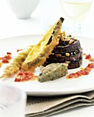 Aubergine tower with deep-fried vegetables