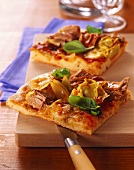 Tuna pizza with artichokes and basil