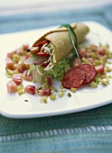 Filled tortilla roll with duck breast and salami