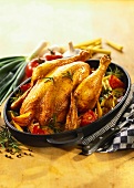 Roast chicken with tomatoes, sweetcorn and onions