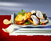 Halibut fillet with vegetables and prawn crackers