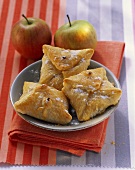 Apple and cinnamon pasties with icing sugar