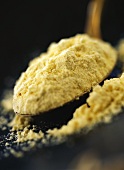 Soya flour on wooden spoon