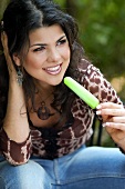 Young woman with ice lolly