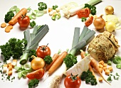 Various types of vegetables grouped around edge of picture