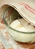 Unbaked bread in glass bowl