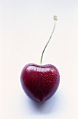 Heart cherry with drops of water
