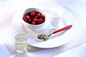 Diet breakfast of raspberries, yoghurt, cereal and water