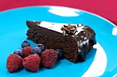 Piece of chocolate cake with fresh berries
