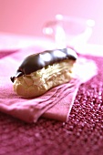 Éclair with chocolate icing