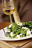 Salad of young spinach, peas and feta