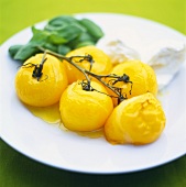 Yellow tomatoes in olive oil