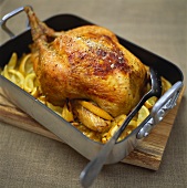 Lemon chicken in roasting dish