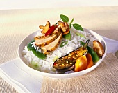 Chicken breast and roasted vegetables on rice