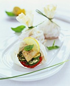 Halibut fillet with vegetables in cooking bags