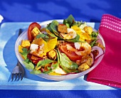 Salad leaves with vegetables, shrimps and oranges