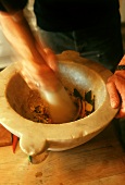 Crushing spices in mortar