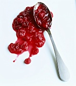 Blob of cranberry jam with spoon